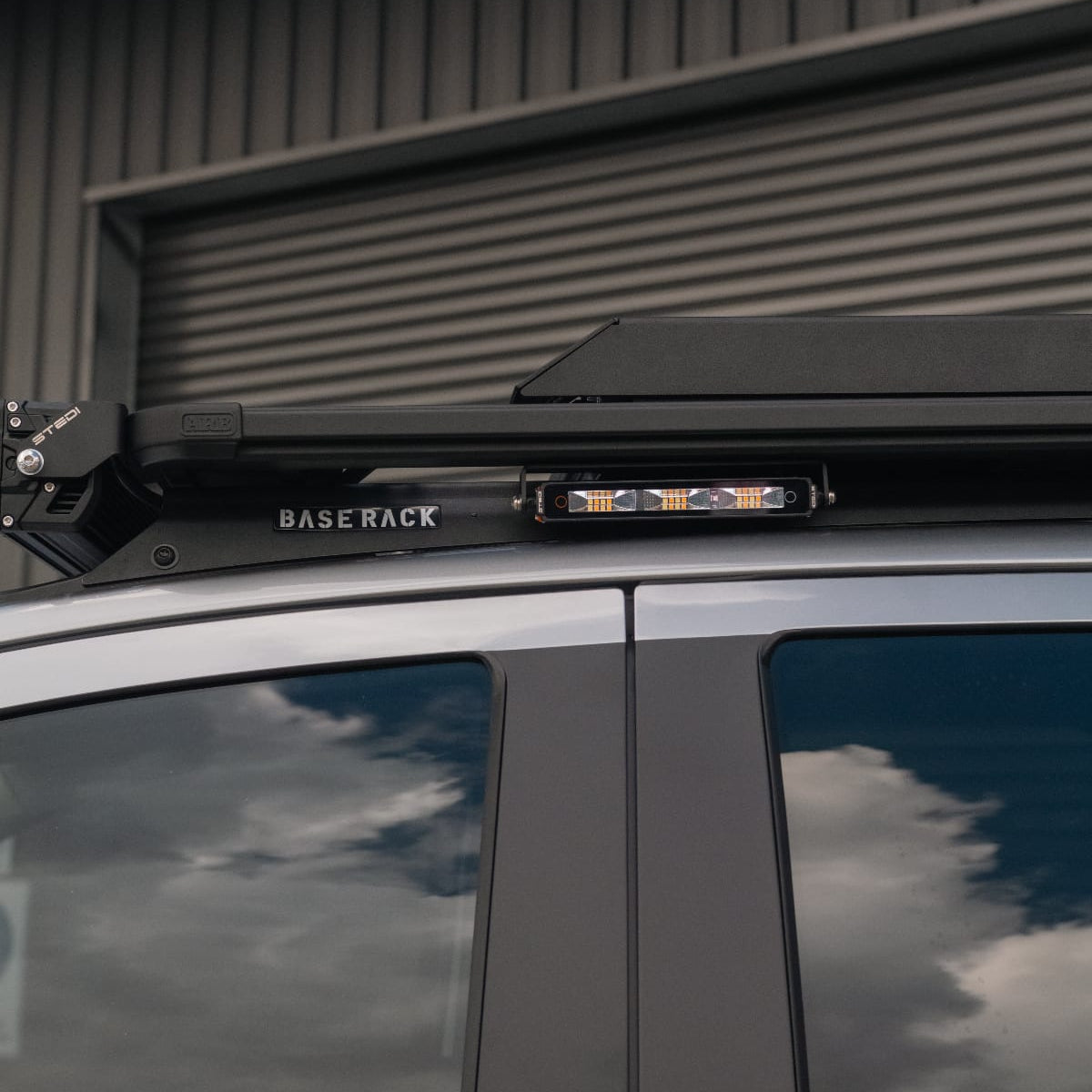 STEDI 7-inch driving light mounted to an ARB Base Rack on a Ford Ranger Super Duty
