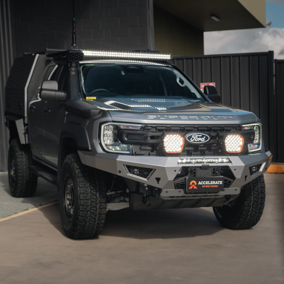 STEDI spotlights and LED light bar illuminated on a Ford Ranger Super Duty