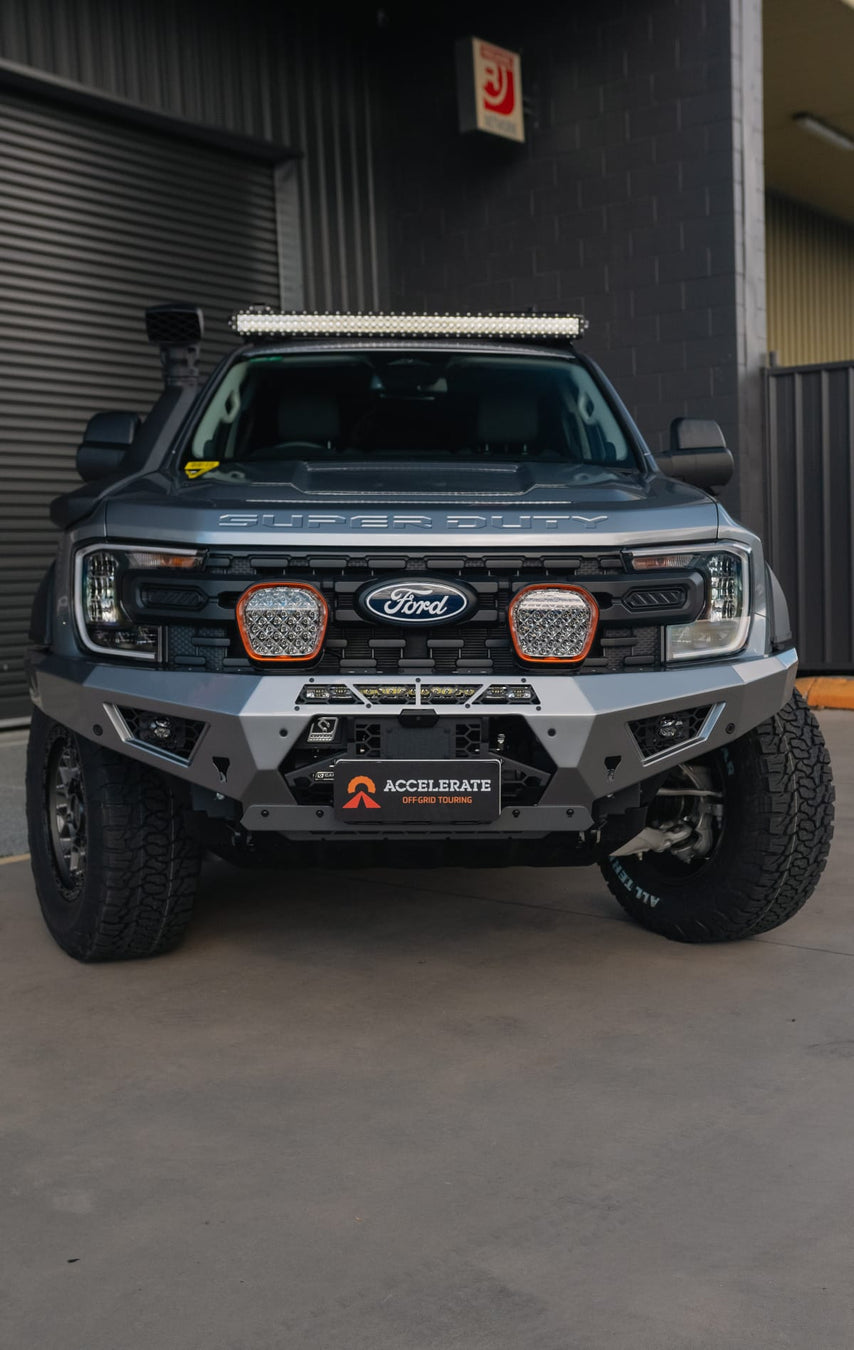 STEDI spotlights and LED light bar illuminated on a Ford Ranger Super Duty